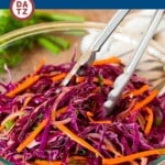 This red cabbage slaw is a blend of shredded carrots, cabbage, red onions and herbs, all tossed in a homemade dressing.