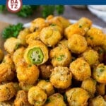 A plate with a pile of crispy fried okra.