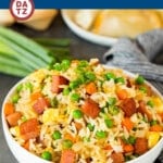 This Spam fried rice is made with seared Spam, eggs, vegetables and rice, all cooked together with seasonings to make a quick and easy meal.