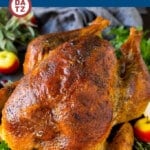 A dry brined turkey that has been roasted and served on a platter.
