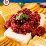 This cranberry jalapeno dip is a blend of fresh cranberries, jalapeno, cilantro, sugar and lime juice, all blended together and served on top of cream cheese.