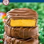 A stack of peanut butter eggs near jelly beans.