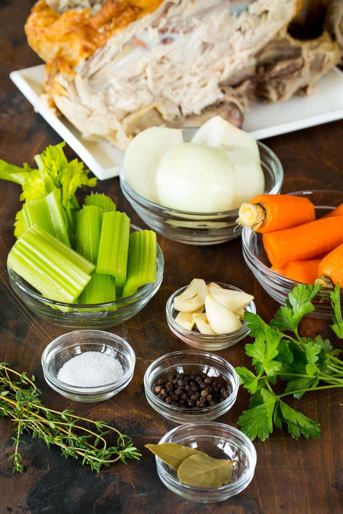 Ingredients including carrots, celery, herbs and spices.
