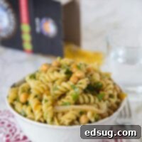 Vibrant Middle Eastern Pasta Salad 2 Middle Eastern Pasta Salad - put a spin on your traditional pasta salad with a chutney lime vinaigrette, chickpeas, cumin and sauteed onions. It is great served hot or cold!