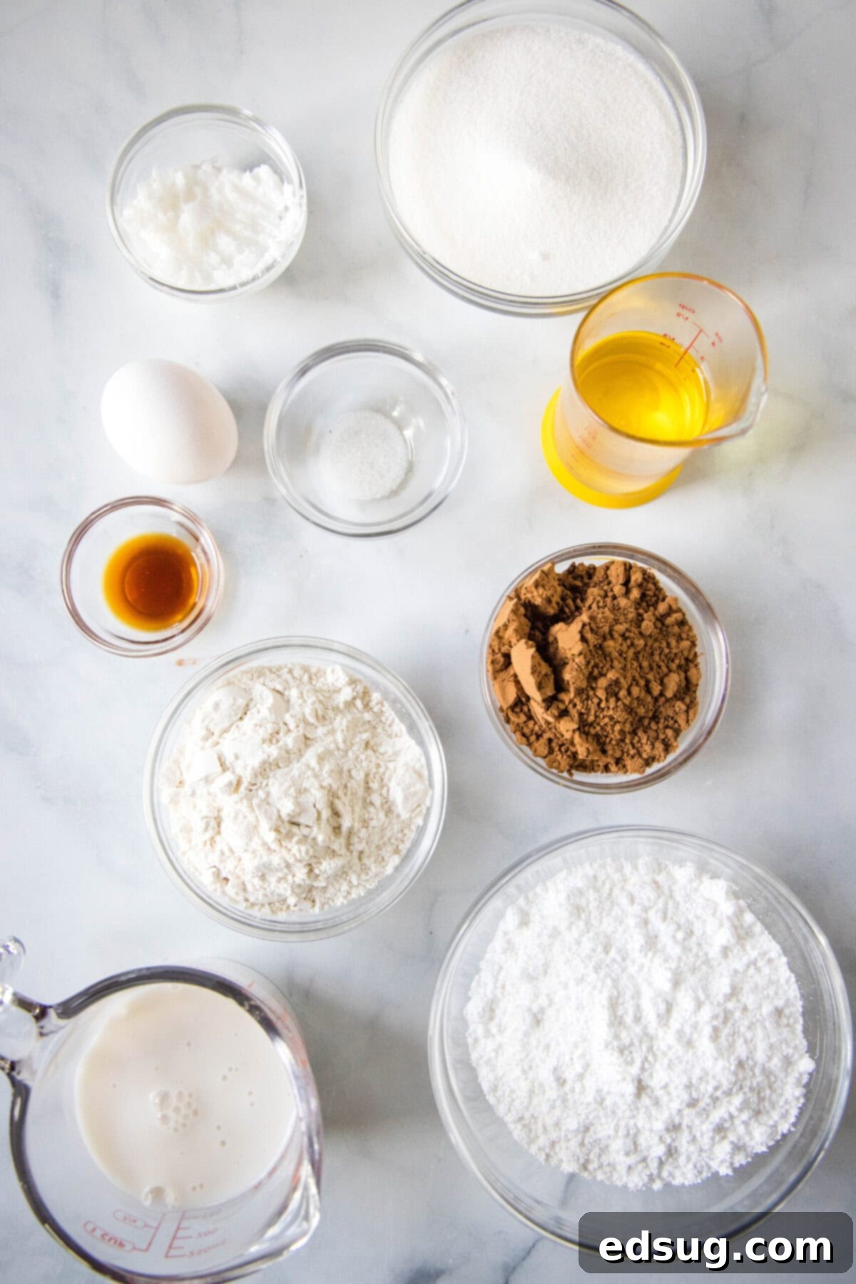 Overhead view of the ingredients needed for dairy free brownies, neatly arranged on a table.