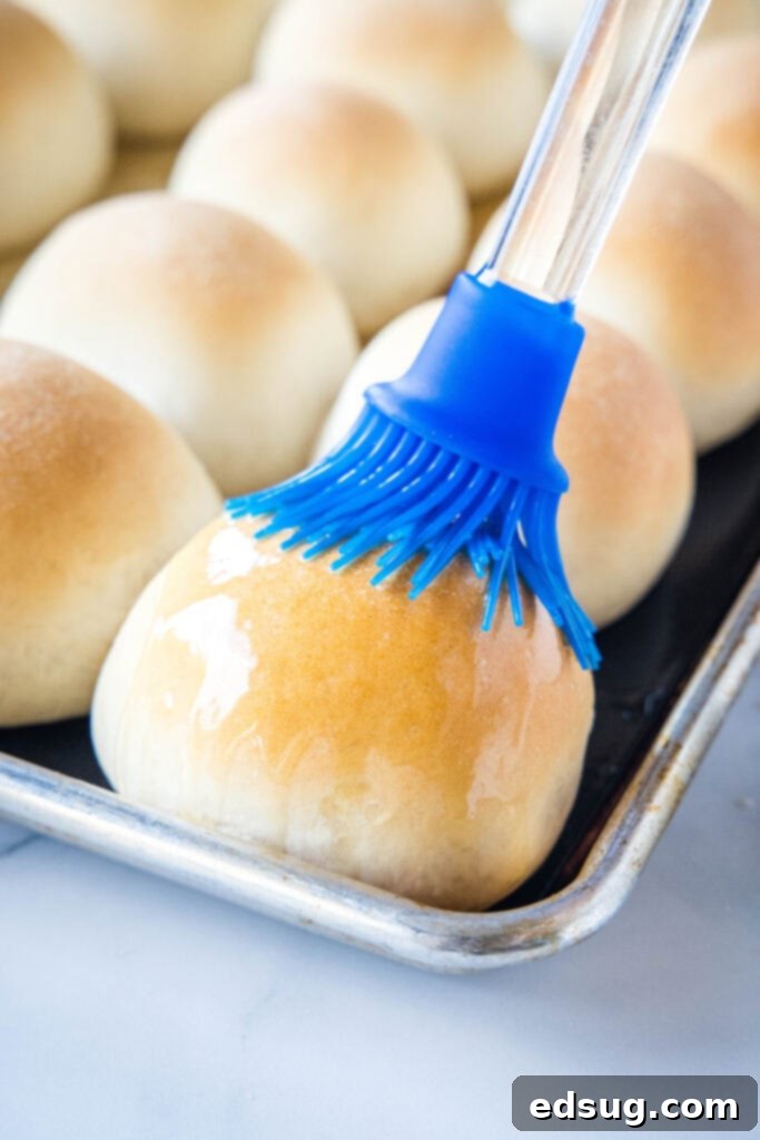 brushing rolls with melted butter