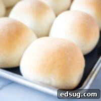 close up baked french rolls on a baking sheet