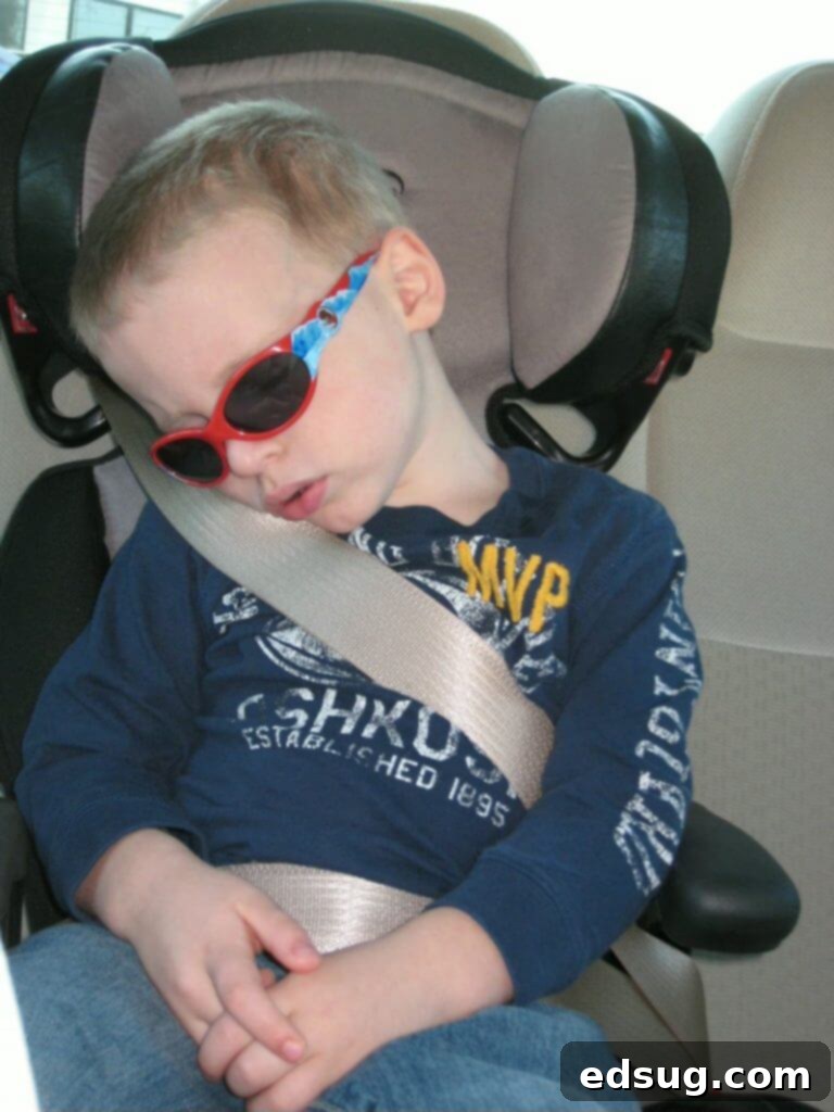 A family enjoying a road trip, with a child looking out the car window, symbolizing the joy of traveling with kids.