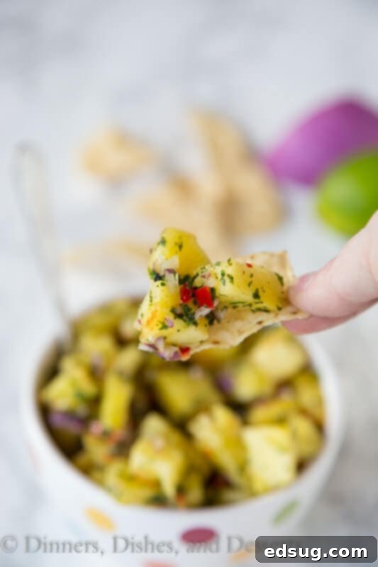 A serving of grilled pineapple salsa in a small decorative bowl.
