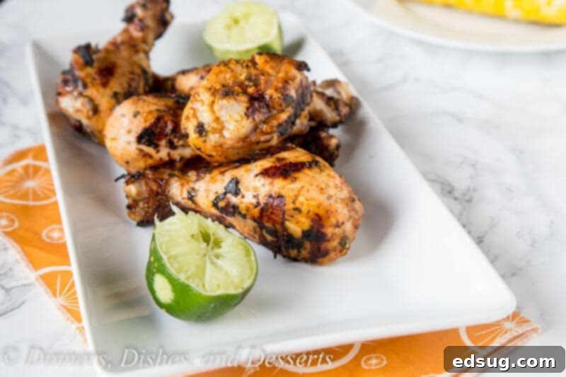 Zesty Chili Lime Grilled Chicken Drumsticks 3 A plate of food on a table, with Chicken and Grilling