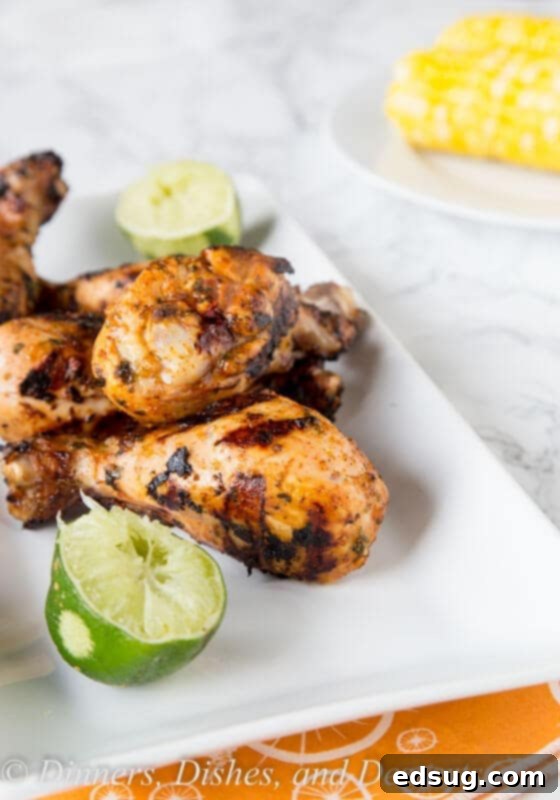 Zesty Chili Lime Grilled Chicken Drumsticks 4 A plate of food on a table, with Chicken and Grilling