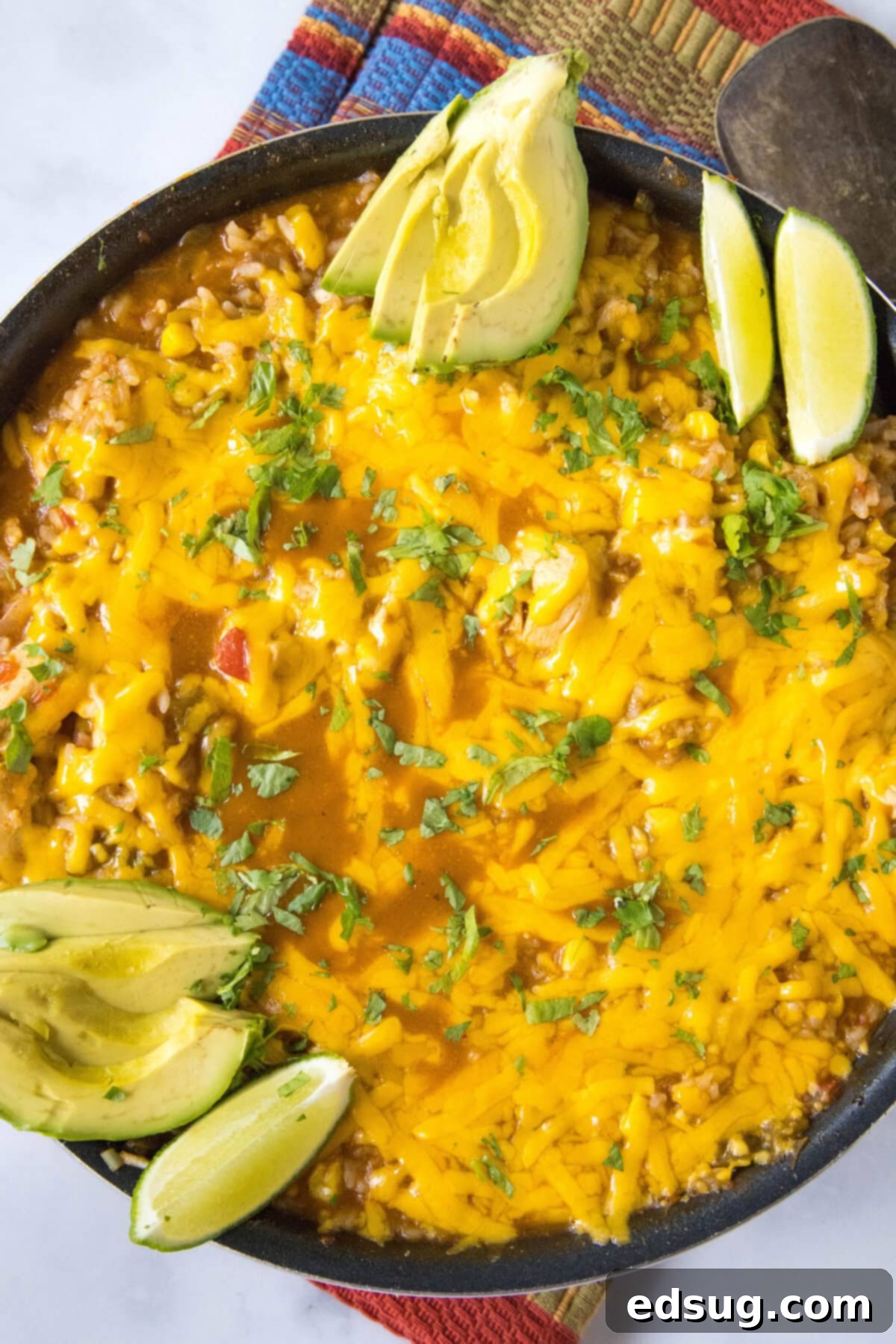 looking down on a southwest chicken skillet with avocado and cilantro