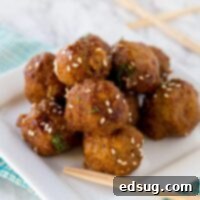Crock Pot Honey Garlic Meatballs - super tender meatballs that simmer in a delicious honey garlic sauce. Great for an appetizer or over rice for dinner.