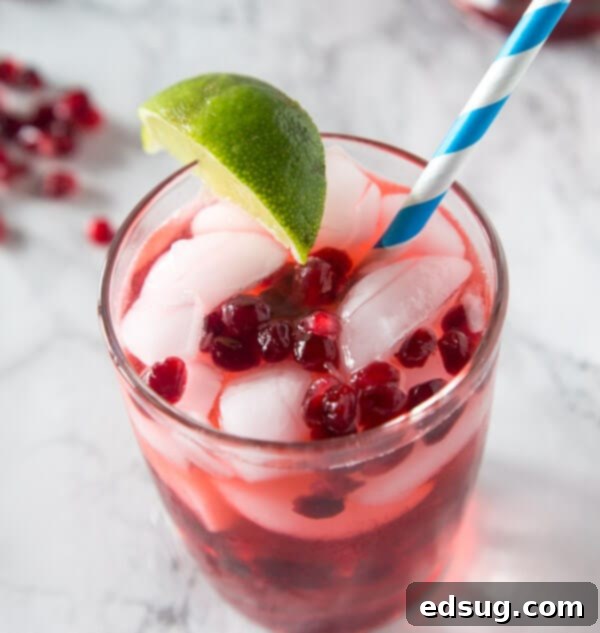 Pomegranate Vodka Gimlet, a classic gimlet with a festive twist of pomegranate.