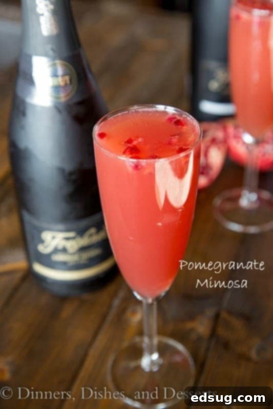 Pomegranate Mimosa, a fun twist on a classic mimosa with pomegranate juice.