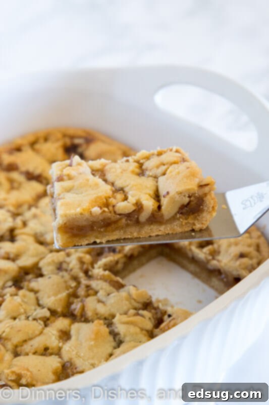 Salted caramel crumble bars cooling in a baking pan