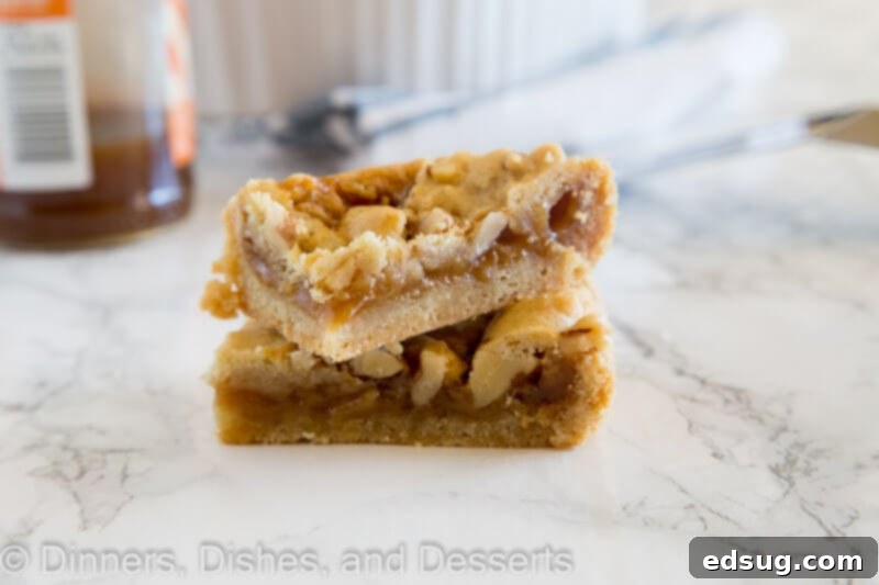 Stacked salted caramel crumble bars on a small plate