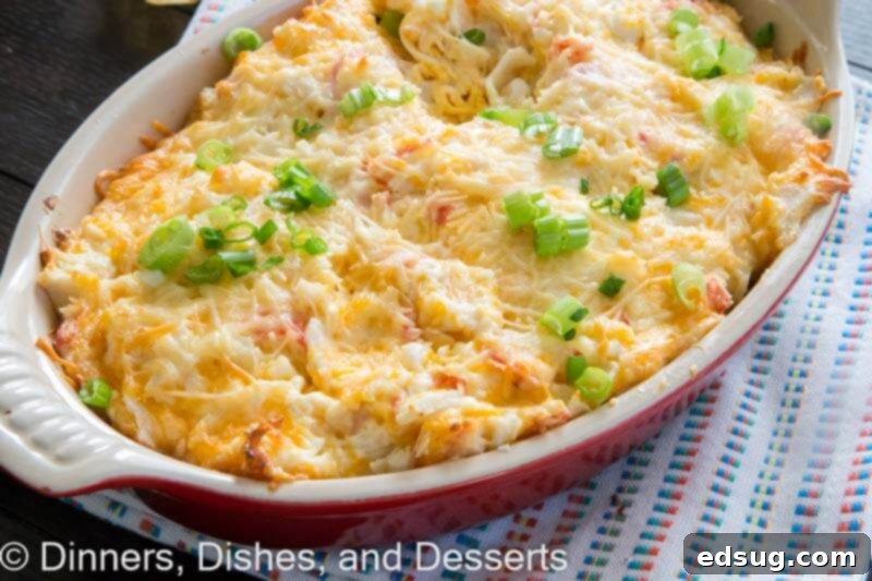 Close up of hot crab dip in a small baking dish, before being served.