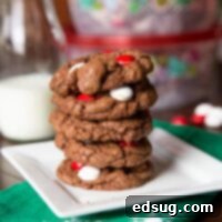 White Chocolate Peppermint Cookies on a plate, rich chocolate cookies with peppermint M&M’s.