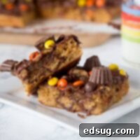 Decadent Reese's Peanut Butter Chocolate Bars served on a white plate