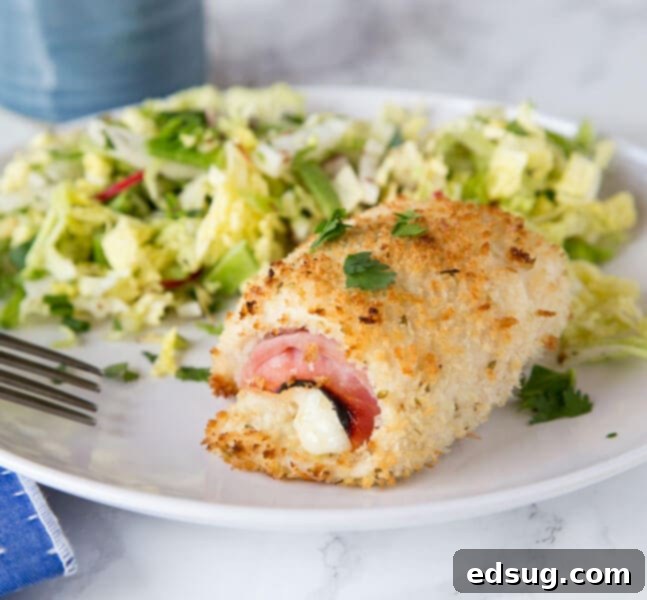 A plate of food, with Chicken and Cordon bleu and salad