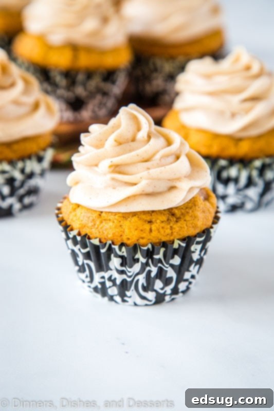 Light and fluffy pumpkin spice cupcakes with creamy cinnamon cream cheese frosting, perfect for fall celebrations