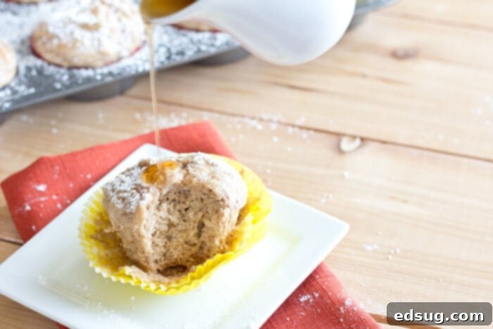 a close up of French toast muffins with syrup soaking into them
