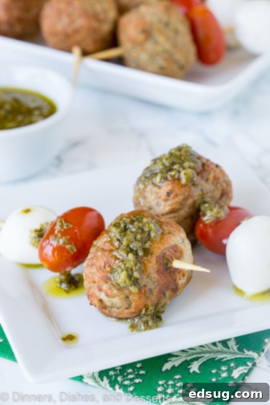 meatball skewer with mozzarella cheese, tomato, meatball and pesto