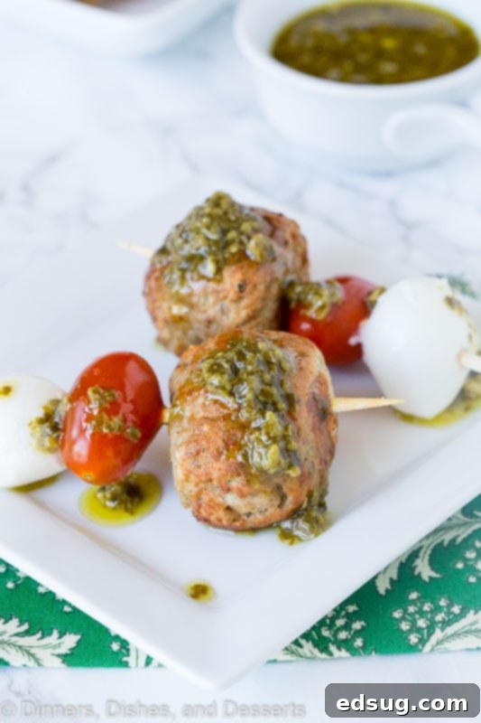 meatball skewer with mozzarella cheese, tomato, meatball and pesto
