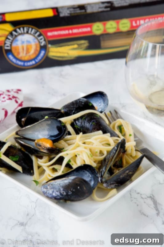 Seaside Mussels Linguine 5 A close-up of steamed mussels in a pan, ready to be tossed with pasta for an easy weeknight meal.
