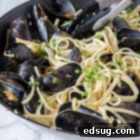 Seaside Mussels Linguine 6 A beautifully presented bowl of Linguine with Mussels, garnished with fresh parsley.