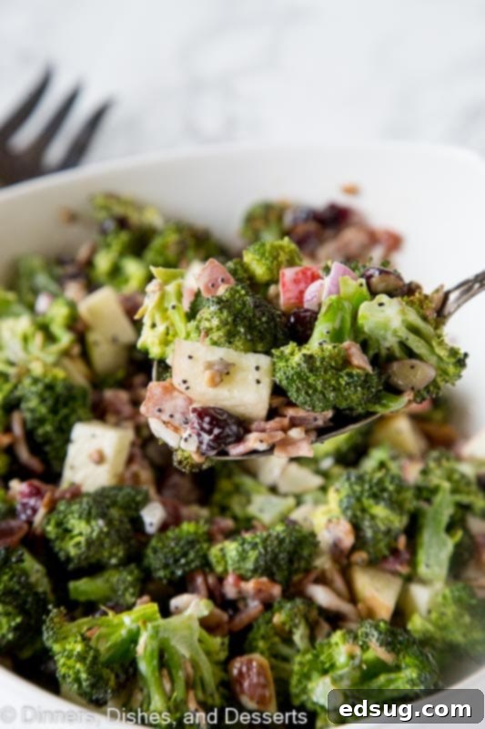 Broccoli Salad Recipe - roasted broccoli salad with bacon, apples, cranberries, almonds, sunflower seeds and a creamy poppy seed dressing!