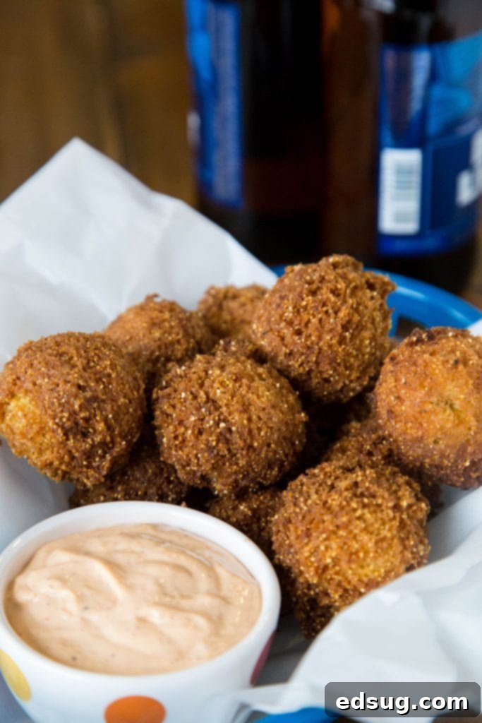 Homemade Hush Puppies Recipe - the lightest and fluffiest hushpuppies ever. So easy to make, delicious, crispy and great for game day, snacks, or even a side dish with dinner. 