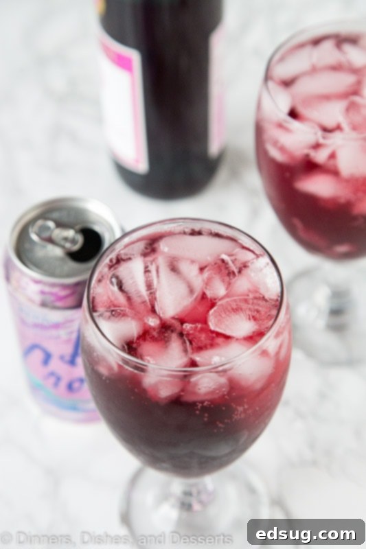 overhead shot of a berry red wine spritzer with a can of Berry La Croix