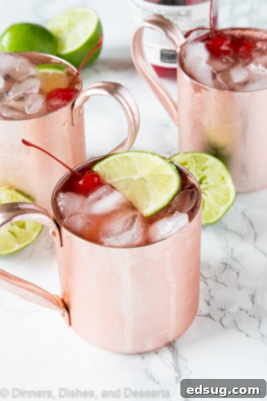 Cherry Lime and Moscow mule in a glass with lime slices