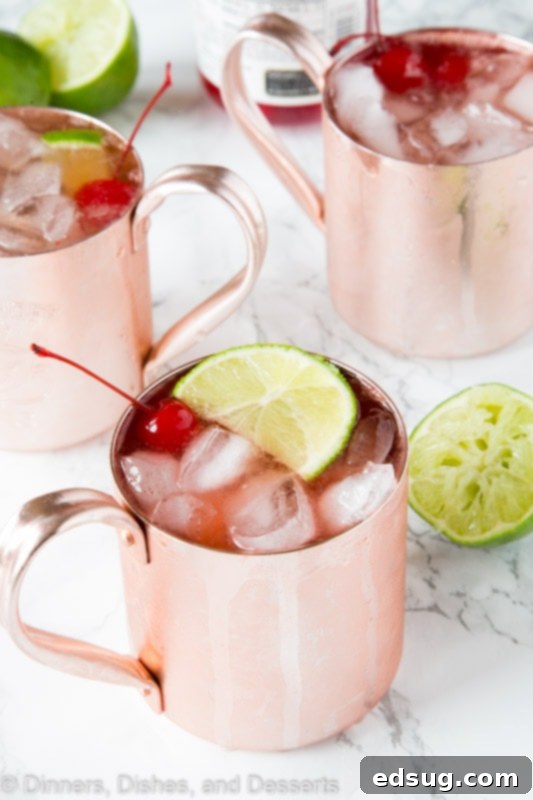 Cherry Lime and Moscow mule in a glass with lime slices