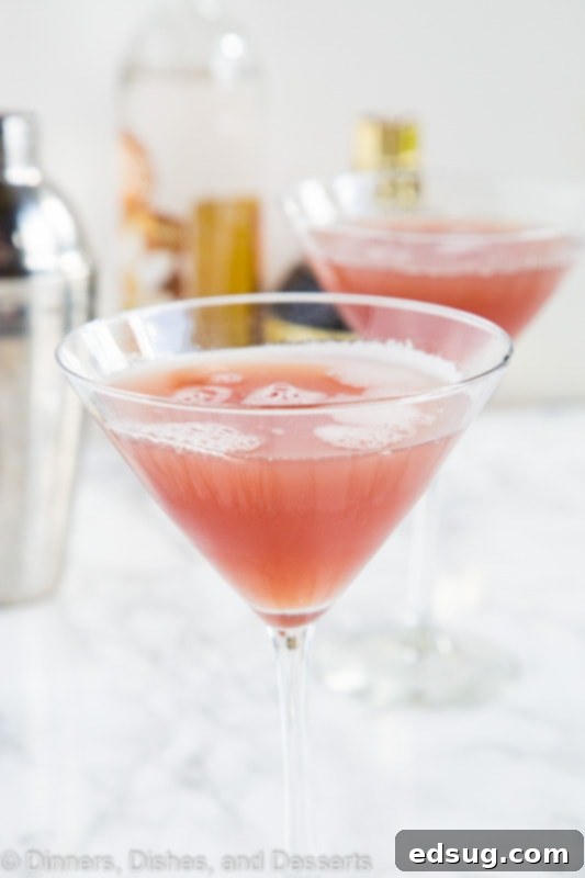 French Martini in a glass, garnished with a raspberry