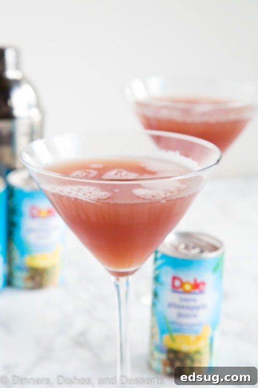 A close up of a glass with a French Martini, showing the beautiful pink color