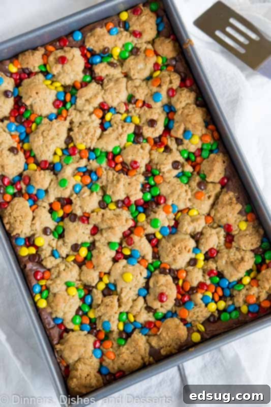 A large pan of M&M Chocolate Oat Bars, cut into squares, ready for serving