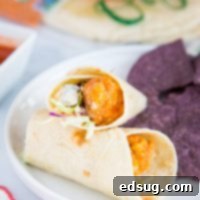 A delicious Crispy Buffalo Chicken Wrap prepared for serving, highlighting its appealing presentation.
