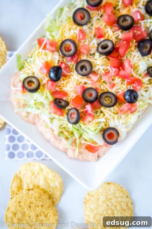 Close-up of easy taco dip recipe ingredients arranged for your next party
