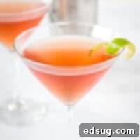 A close-up view of a perfectly chilled Cosmo cocktail