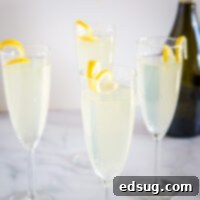 A table with wine glasses, suggesting a celebratory occasion for the French 75 cocktail.
