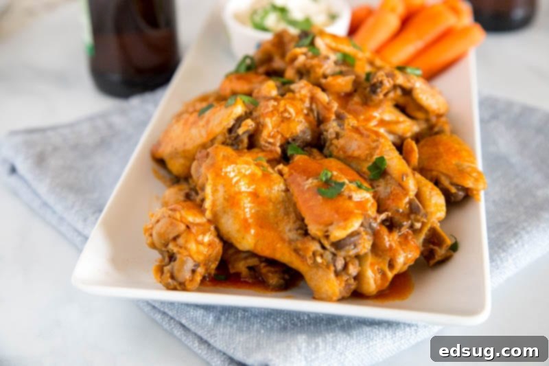 A large platter of Instant Pot Chicken Wings, perfectly sauced and ready to serve at a party