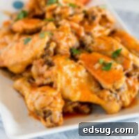 Crispy Instant Pot Chicken Wings 7 A close up of chicken wings on a plate, with Chicken