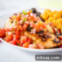 Margarita Grilled Chicken - a super easy copycat recipe from Chili's restaurant. Flavorful chicken grilled and topped with a fresh pico de gallo for an easy and delicious dinner.