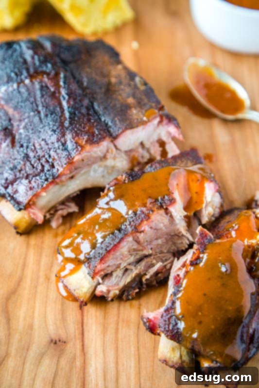 Slow-Smoked Baby Back Ribs 5 Smoked baby back ribs brushed with barbecue sauce
