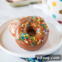 Homemade Donuts - soft and fluffy yeast donuts you can make in your own kitchen! Just like going to the bakery only warm and delicious at home. Top with chocolate, vanilla, or dust in cinnamon sugar. Even fill them with cream or jelly. The options are endless!