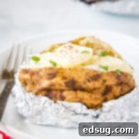 Grill-Baked Potatoes 6 baked potato with butter on a plate