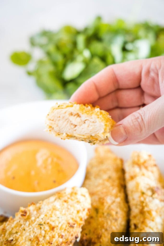 Crispy Air Fryer Chicken Tenders 6 Close-up of a bite taken from a crispy chicken tender